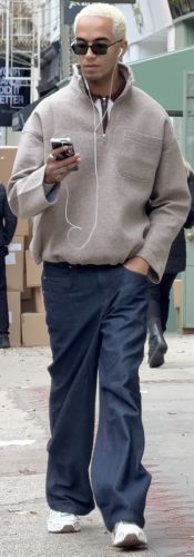 cozy sweater quarter-zip paired with dark blue baggy jeans