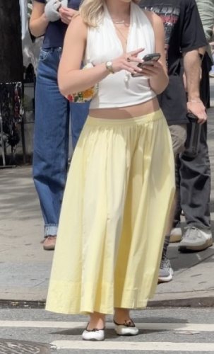 yellow skirt with a white halter top