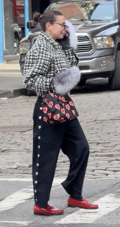 puffer bag, and jeans with button