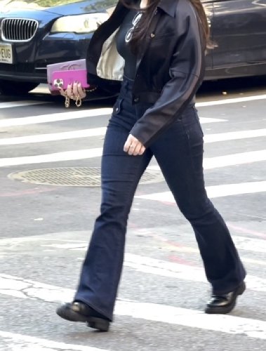 black loafer and form-fitting bootcut jeans