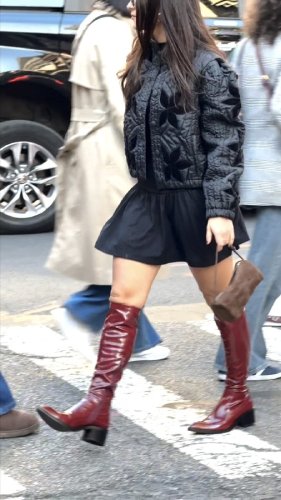 The red boots. The puffer jacket. The suede handbag