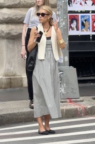 black and white gingham printed dress with a cream sweater