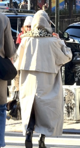 tan nylon coat , cheetah scarf layered over and the black boots