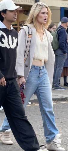 grey trench coat layered over the top