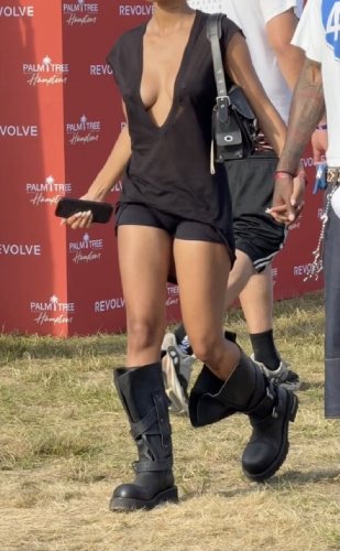 low-cut tunic top paired with black micro shorts