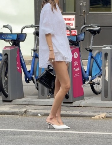 white linen button-down shirt and white ruffle linen shorts