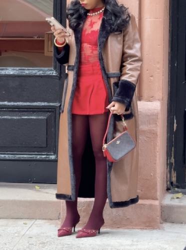 burgundy tights, a pleated skirt, a lace top, and kitten heels