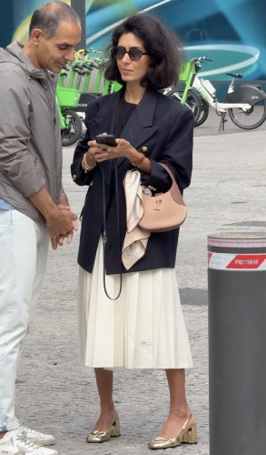 cream Prada skirt and a navy blazer