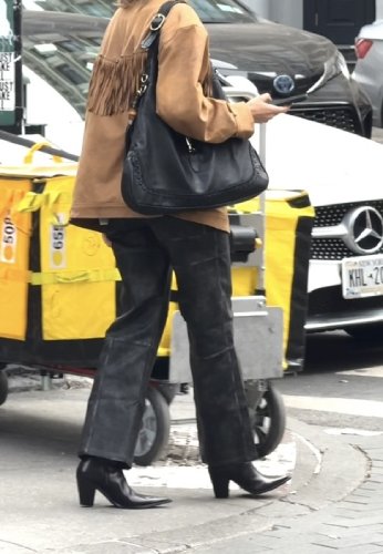 Black jeans and black heeled pointed boots