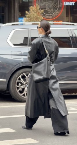 long leather trench coat and thin-heeled boots