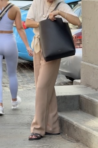 light brown trousers and sleek white tee