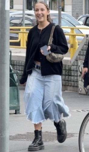 denim maxi skirt and a relaxed black cardigan