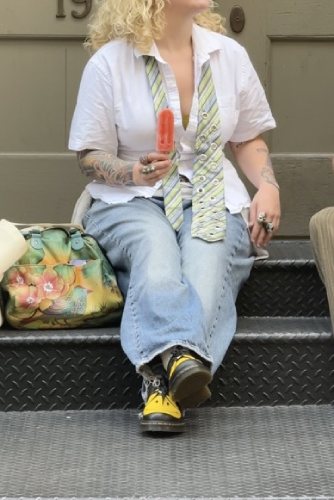 white button-down tee and light-wash jeans